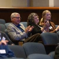 Event attendees clapping